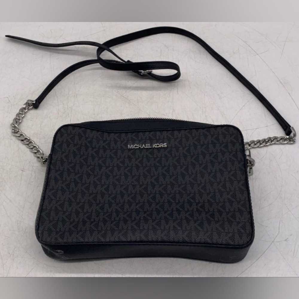 Michael Kors Black Crossbody Bag with Signature MK Design.